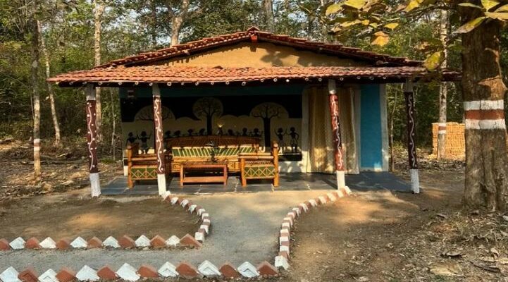 A beautiful traditional mud house surrounded by the lush green forests of Devpur Nature Camp near Barnawapara, Chhattisgarh.