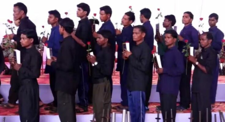 A conceptual image depicting surrendered weapons and security personnel highlighting the major Bastar Naxal surrender in Chhattisgarh.