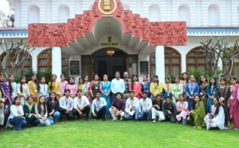 A group of enthusiastic college students interacting with officials during their first educational visit to Lok Bhavan in Raipur.