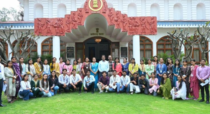 A group of enthusiastic college students interacting with officials during their first educational visit to Lok Bhavan in Raipur.