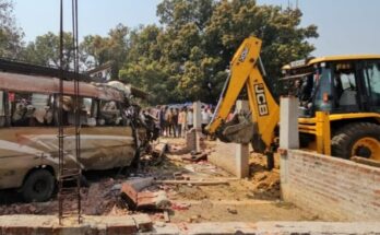 A passenger bus overturned on the side of the road after a tragic accident in Jashpur, Chhattisgarh.