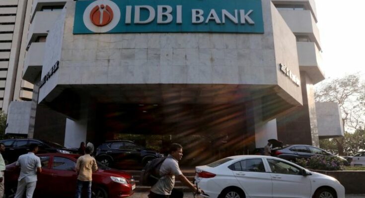 A conceptual business image showing the IDBI Bank logo and a downward financial arrow, representing the lower bids and stalled privatization process.