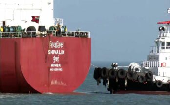 A conceptual geopolitical image showing the flags of India and Iran alongside a commercial oil tanker traversing the Strait of Hormuz during the ongoing crisis.