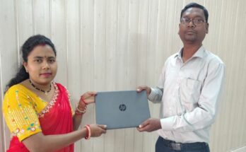 A confident Indian woman, Sangeeta Singh, working on a laptop at her CSC center, representing women empowerment and digital self-reliance in Chhattisgarh.