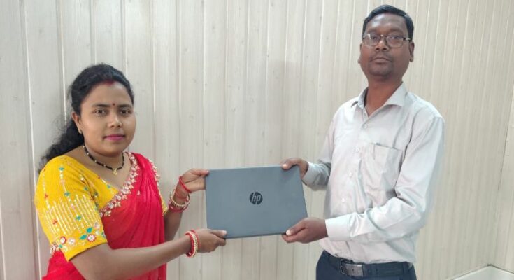 A confident Indian woman, Sangeeta Singh, working on a laptop at her CSC center, representing women empowerment and digital self-reliance in Chhattisgarh.