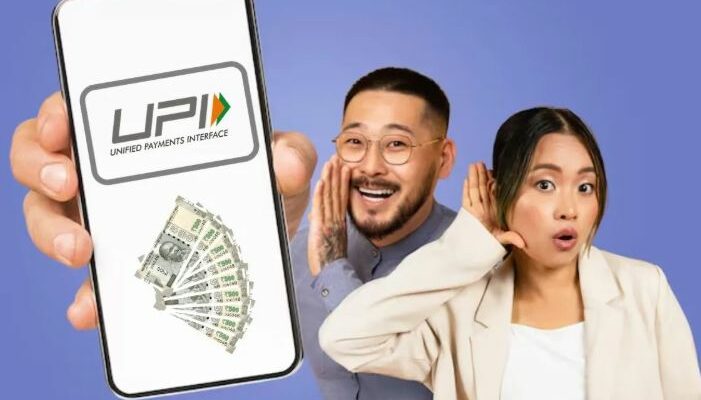 A person holding a smartphone using a UPI payment app like Google Pay or PhonePe.