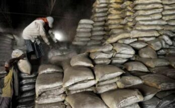 A conceptual image showing stacked cement bags and rising price graphs, highlighting the sudden CG cement price hike and political allegations in Chhattisgarh.