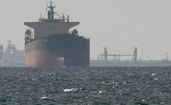 A conceptual image showing a commercial ship on fire in the sea after a drone attack, highlighting the recent Iran-Israel war escalation in the Strait of Hormuz.
